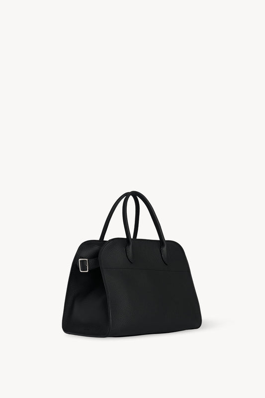 The Row Soft Margaux 12 Bag in Black, three-quarter angle view — The Quiet Edition