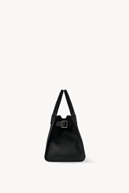 The Row Soft Margaux 12 Bag in Black, side view with buckled gusset — The Quiet Edition