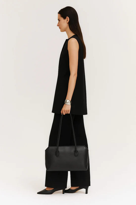 The Row Terrasse Leather Shoulder Bag in black, on model — The Quiet Edition
