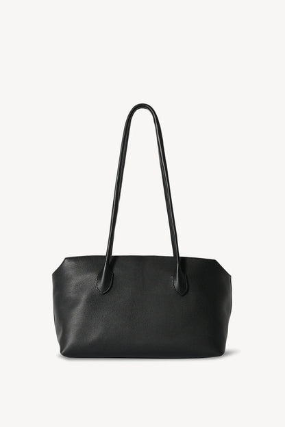 The Row Terrasse leather shoulder bag in black, front product view — The Quiet Edition
