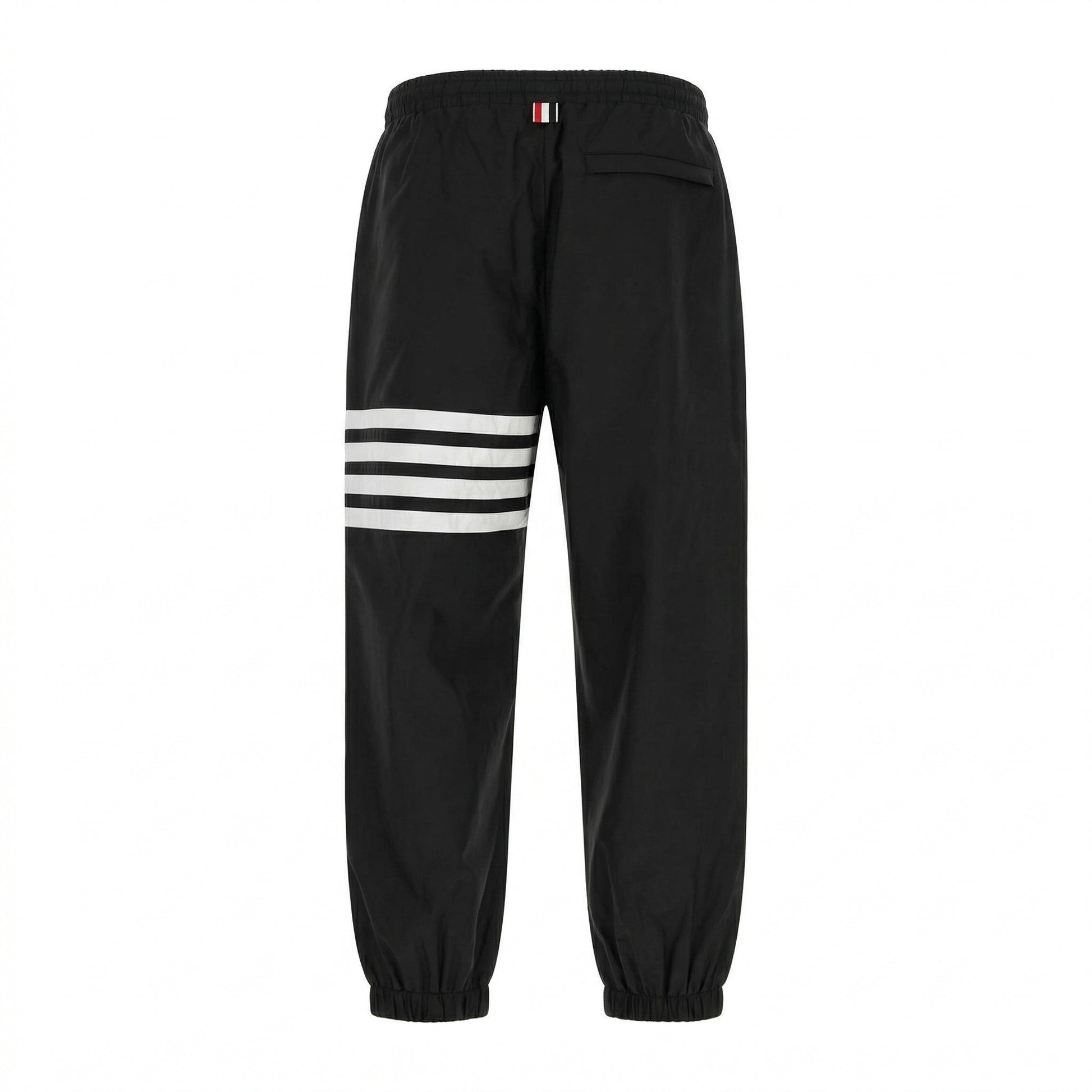 Thom Browne 4-Bar track pants in black, back view — The Quiet Edition