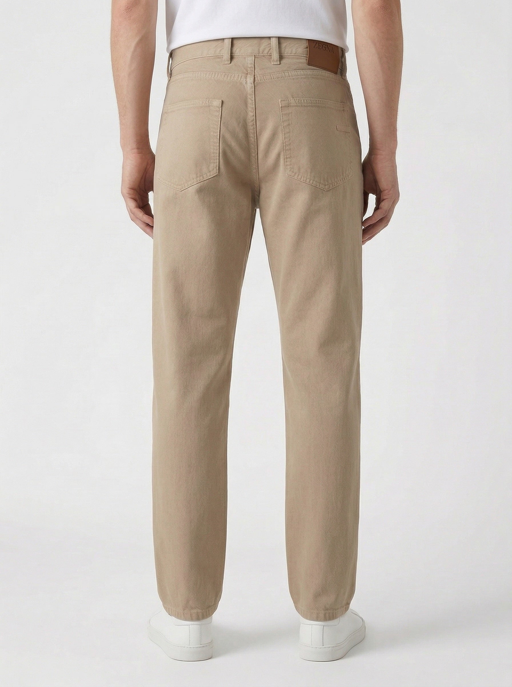 Z Zegna five-pocket cotton trousers in sand, on model back view — The Quiet Edition