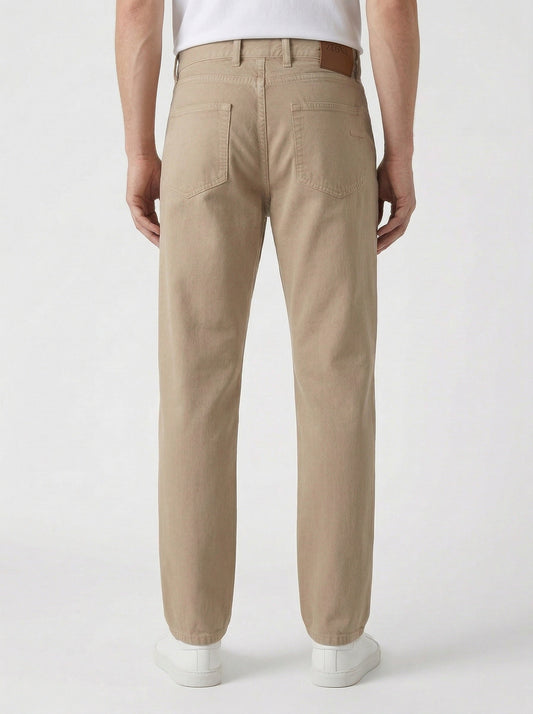 Z Zegna five-pocket cotton trousers in sand, on model back view — The Quiet Edition