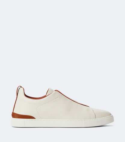 Zegna Triple Stitch leather sneakers in white, side profile with white rubber cupsole
